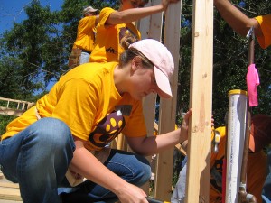 LSU architecture student in yellow shirt builds house for Habitat for Humanity