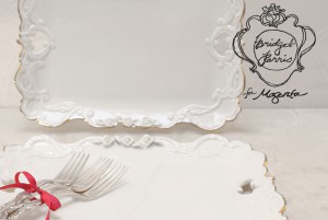 Ornate white platter, silver forks