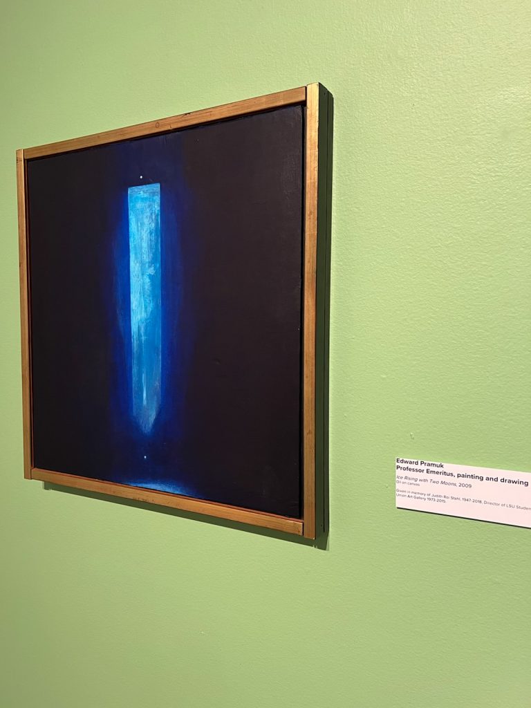 painting with glowing shaft of blue light